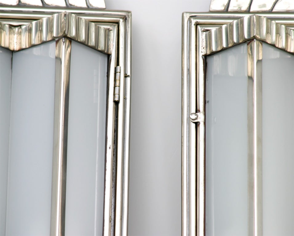 Fabulous pair of dramatic sconces from the Art Deco period. All original finish and glass panels. 39