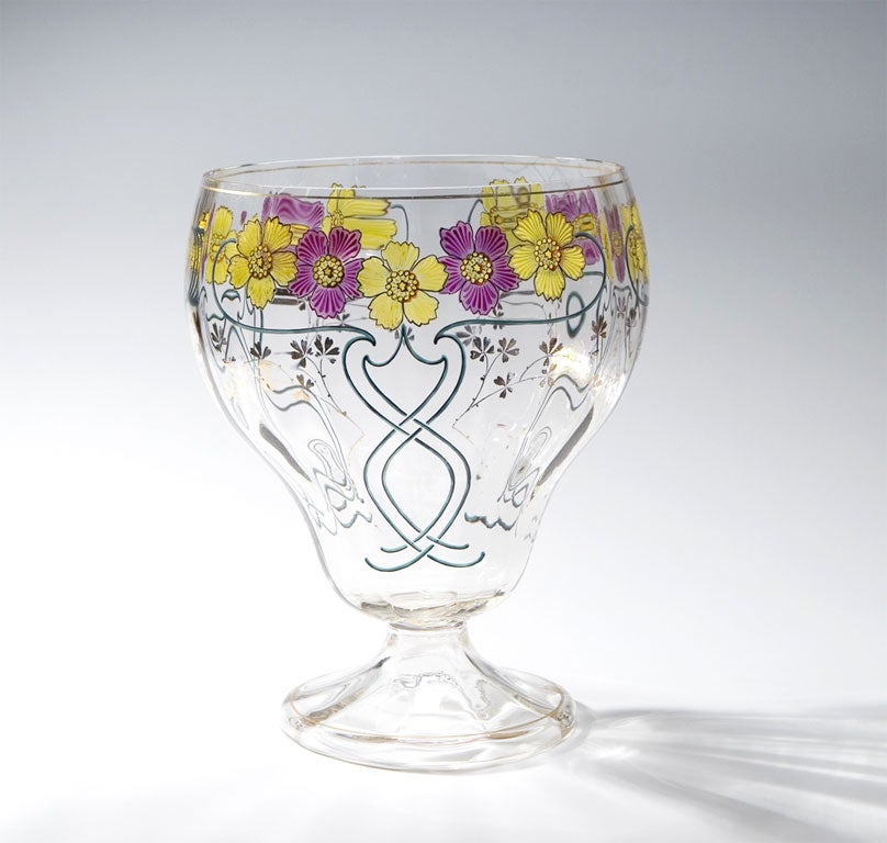 Here is a handblown crystal optic ribbed centerpiece or is it a punch bowl or even better, filled with flowers, used as a large vase. Hand-painted transparent enamel in vibrant lavender and yellows in Classic Art Nouveau decoration. Large and