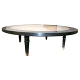 Large round travertine table by Baker