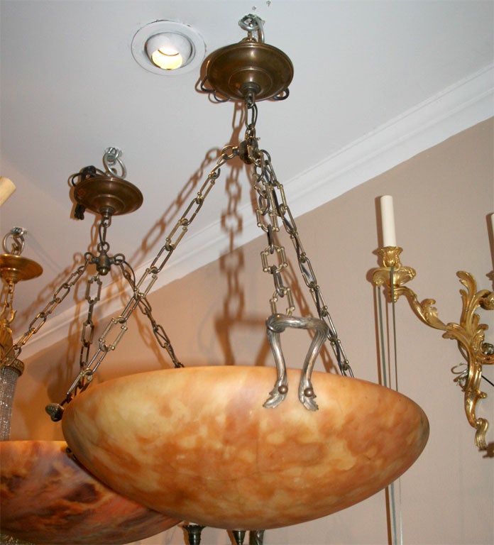 A pair of alabaster light fixtures