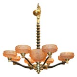 An eight light chandelier by  Edgar Brandt