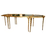 A gilt metal cocktail table by Bagues
