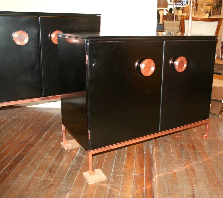 Pair of black lacquered commodes