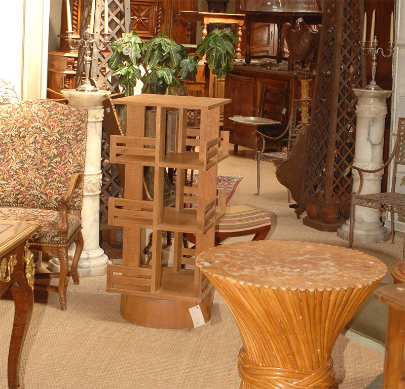 Teak revolving bookcase, in the style of Charlotte Perriand at 1stDibs