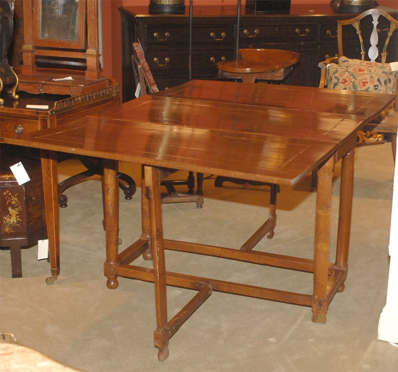 A late 19th century, Italian fruitwood drop leaf table. Opens to 62