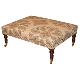 A Large Scale Medallion Upholstered Ottoman