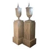 Pair of Covered Zinc Urns on Pedestals