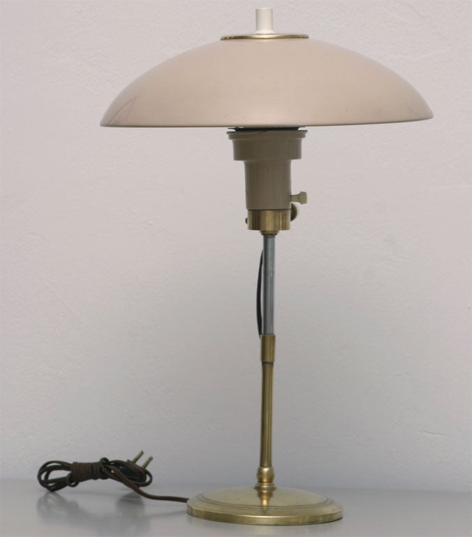 We love desk lamps...and this is one of our favorites! Adorable, brass-trimmed lamp from the 50's has a vertically adjustable, beige  enamelled dome shade. Hurry before we take this one home ourselves!