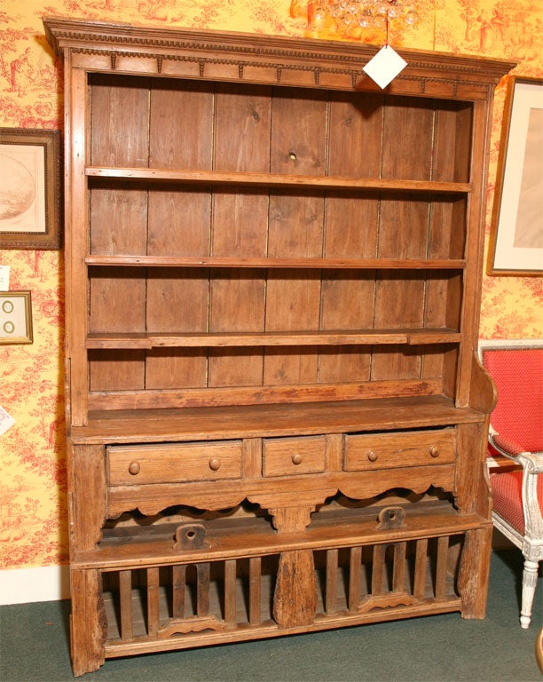 A EARLY IRISH KITCHEN COOP DRESSER WITH COMPARTMENTS AT THE BOTTOM TO HOLD LIVE FOWL, UNTIL NEEDED. IT IS ALSO FITTED FOR WINE BOTTLES. JUST UNDER THE DRAWER.