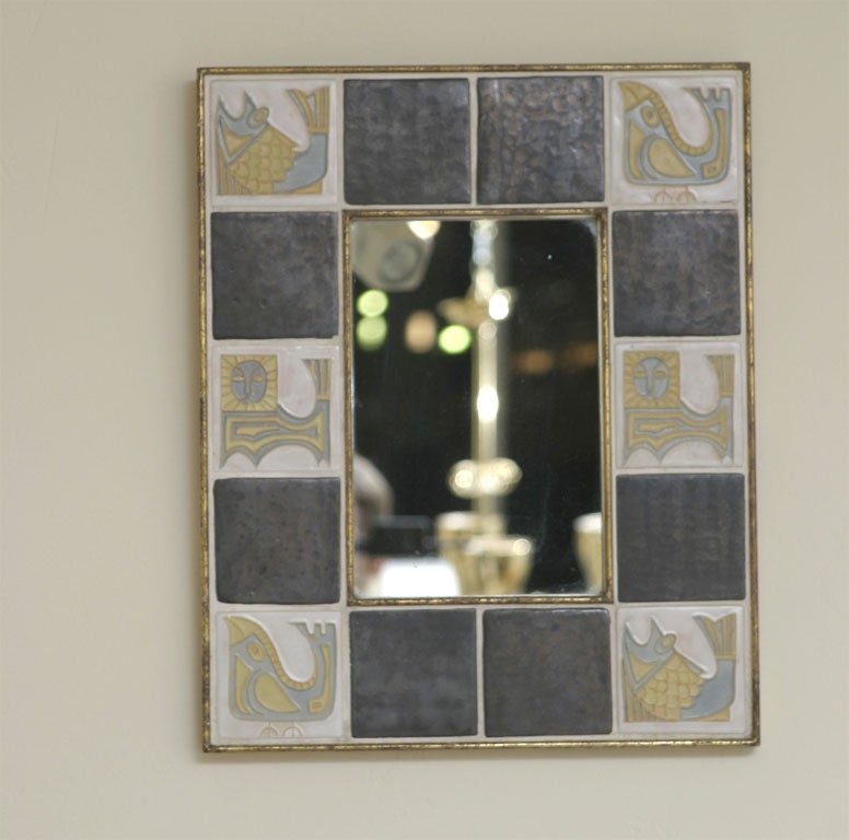 Cubist fish motif tile framed mirror.