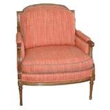 A Louis XVI-style Upholstered Fruitwood Bergere