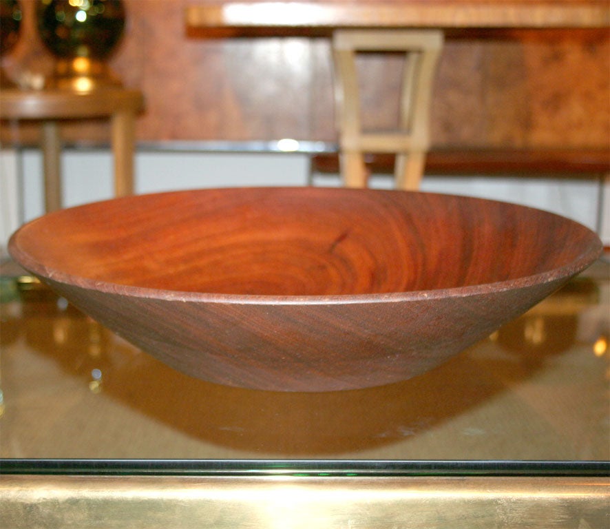 A large lathe turned wood fruit bowl from Guatemalan mahogany. By California craftsman Bob Stocksdale. U.S.A., circa 1960.