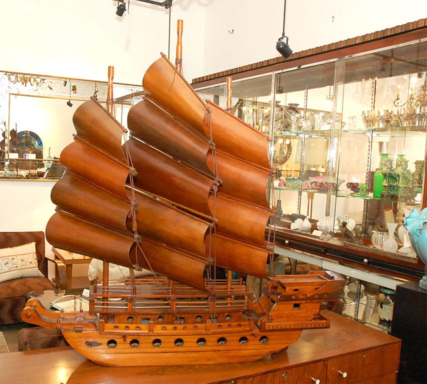 Of traditional Chinese design with rectangular sails spread by battens, a high stern and flat underside.