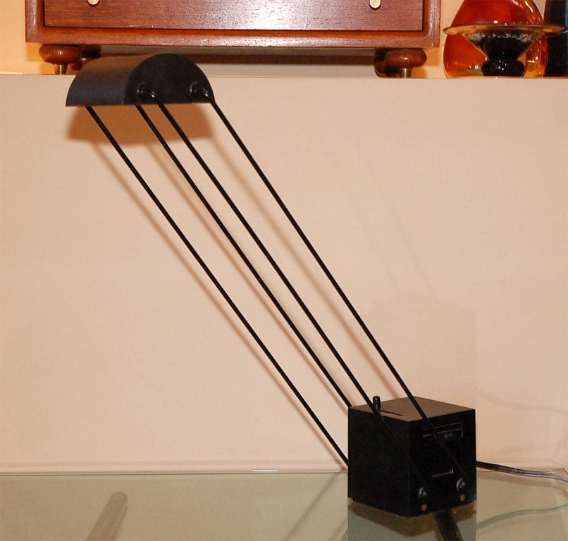 Unique table halogen bulb lamp with heavy steel base, to allow the difuser to pivot and cantalever at many angles.  This piece was a 1981 Compaso d'Oro winner.