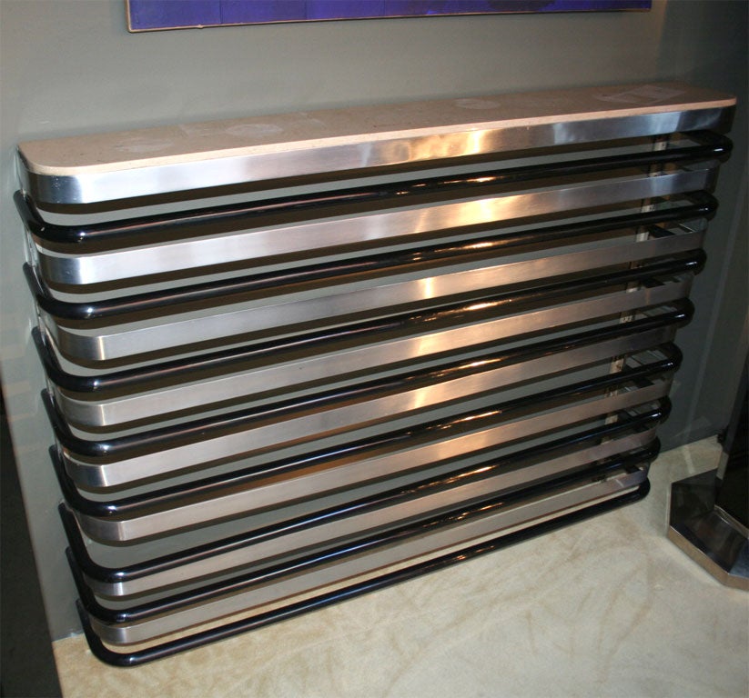 Satin chrome and enameled iron radiator cover/console with marble top.  By Robert Mallet-Stevens, French 1930.

53