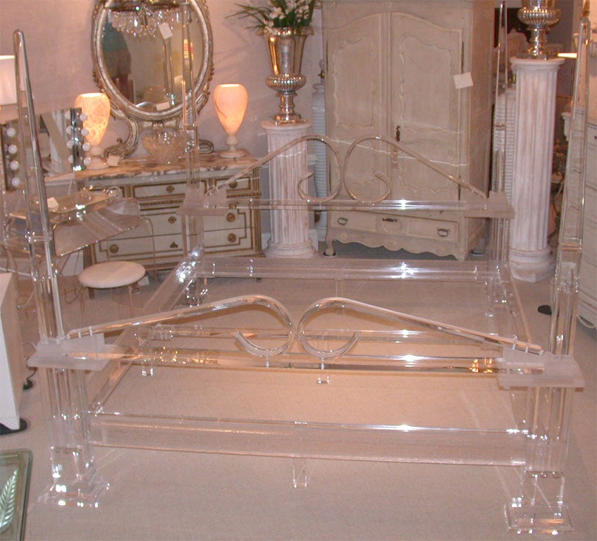 Spectacular custom made lucite 4-poster king sized bed. The lucite ia a clear lucite and does not have the pinkish hue that shows in some photos. The bed is circa 1970.