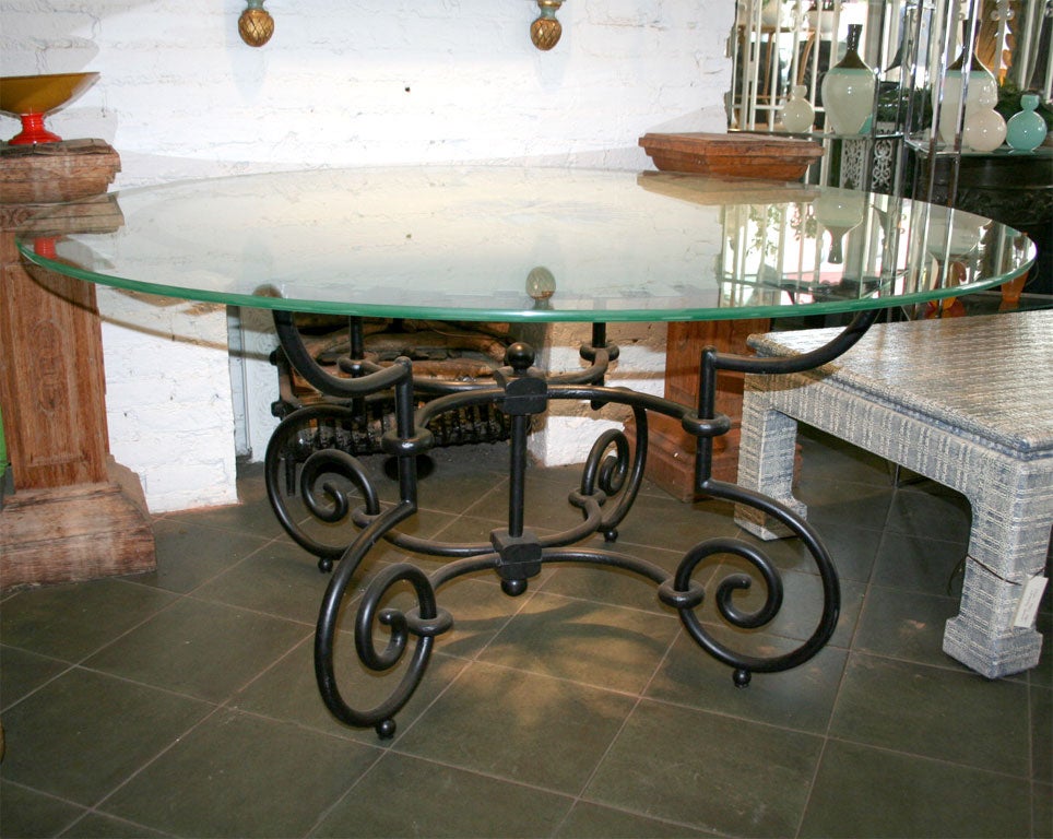 Flawless design, truly amazing etched glass top. Wrought iron sculpted base. Would make an amazing outside table and would work well for indoor use too.