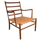 A wood and cane lounge chair,