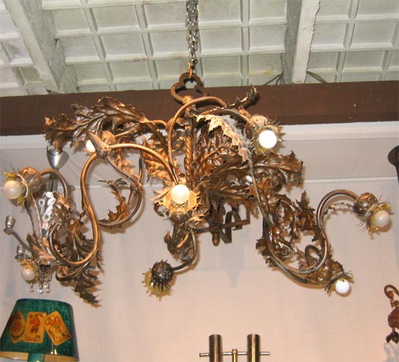 1940-1950 wrought iron chandelier shaped like Canada thistle, with nine arms, attributed to Emile Robert.