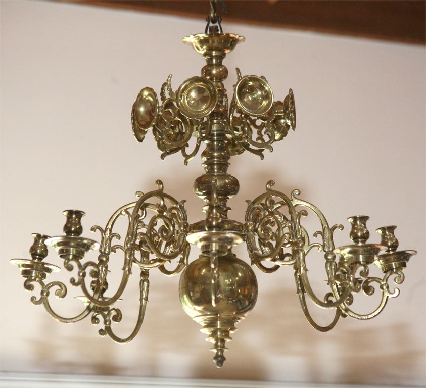 Brass candle chandelier from the Russian Baltic region, circa 1860. Eight candle arms and eight reflectors extend from a heavy central baluster.  Not electrified.