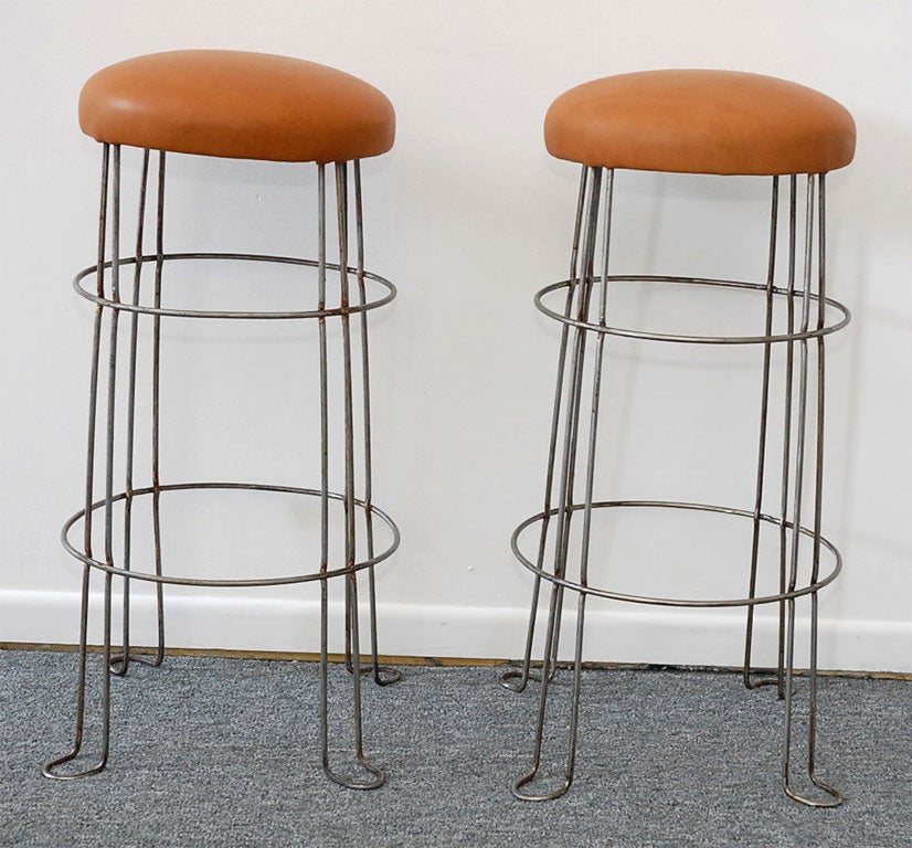GREAT AND WONDERFUL INDUSTRIAL METAL BAR STOOLS WITH LEATHER SEATS.SOLD AS A PAIR ONLY.