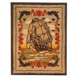 1930'S PICTORIAL HAND HOOKED MOUNTED RUG OF A SHIP AT SEA