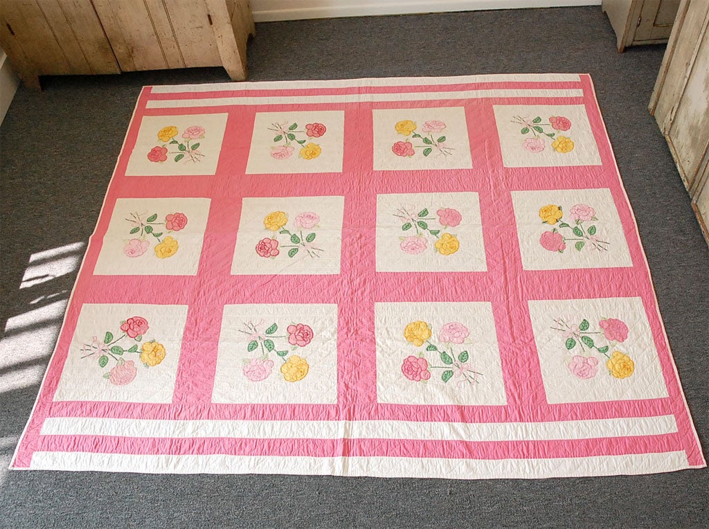 1930'S PINK & WHITE APPLIQUED AND EMBROIDERED QUILT