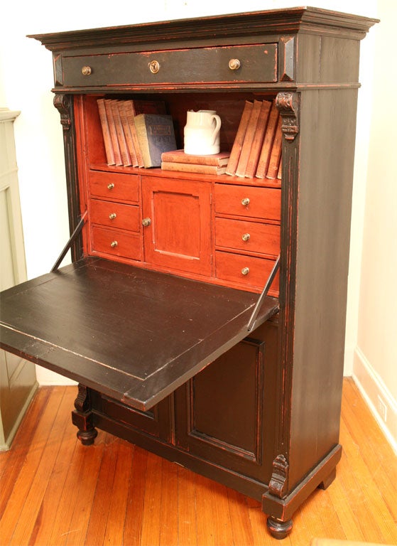 This stunning drop front secretary is wonderful to look at and so useful as well. At the top is wonderful crown molding, below there is a long drawer.When the drop front is opened there is a book shelf followed by six small drawers and cubby that
