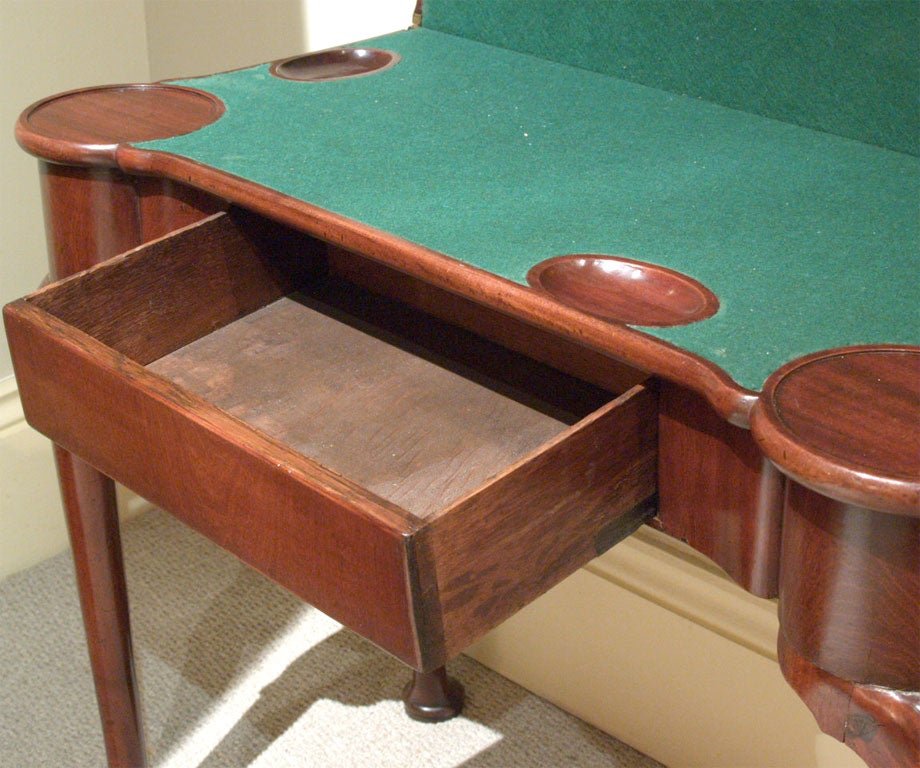 Circa 1750 English George II mahogany fold-over game table.