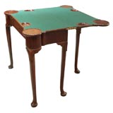 Circa 1750 English George II mahogany fold-over game table. Circa 1750 English George II mahogany fold-over game table.