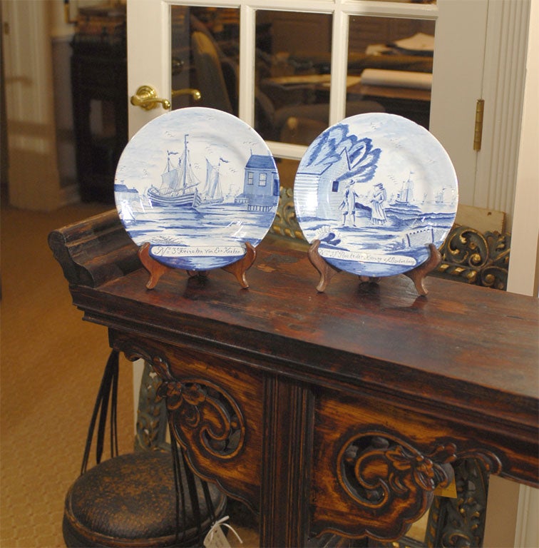 Pair of 19th Century Dutch Delft Blue and White Plates showing a charming detailed nautical scene.