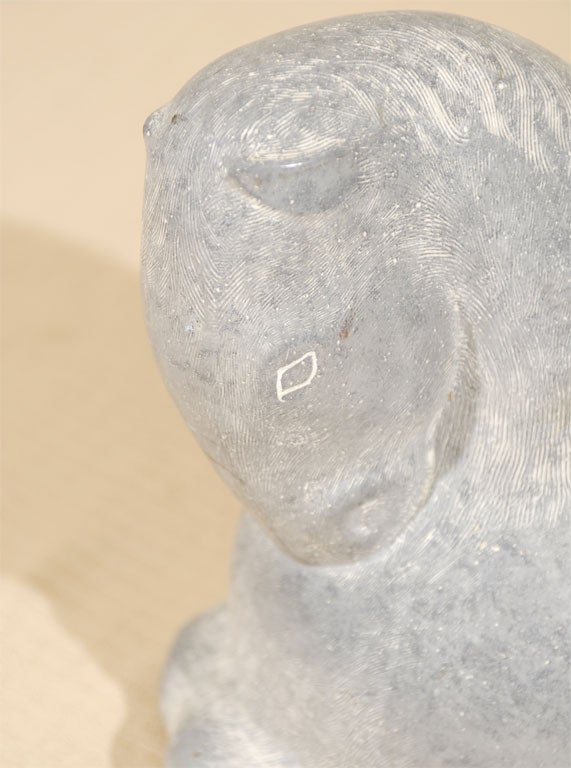 A carved marble horse with wonderful modernist flowing lines.It is well proportioned and has wonderful robust form.  The patina is soft and mellow.