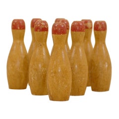 Antique Set of Nine Miniature Bowling Pins with Red Tops