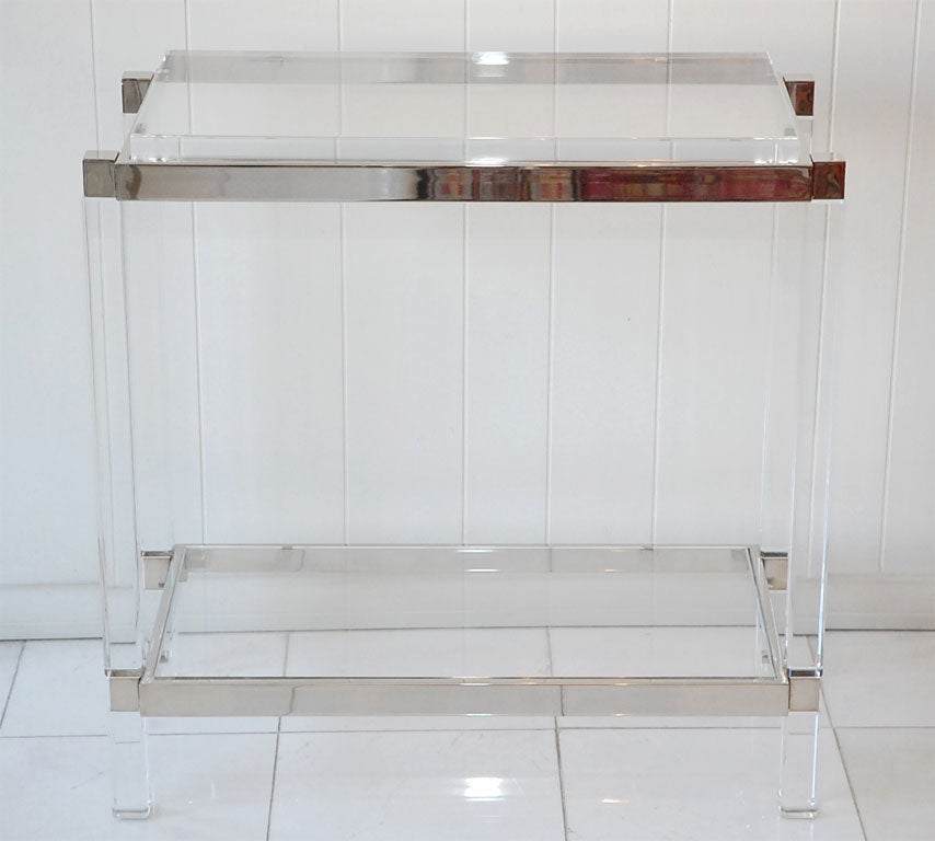 A pair of Charles Hollis Jones Metric Line side tables. Nickel and Lucite with two tiers for display. Price is for the pair.