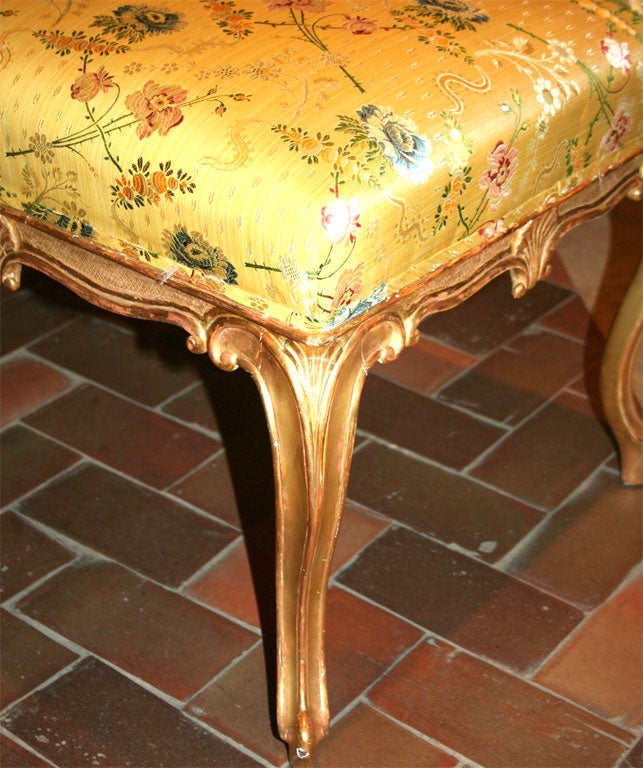 Fine George III French Hepplewhite giltwood stool with shells and crosshatched carving.