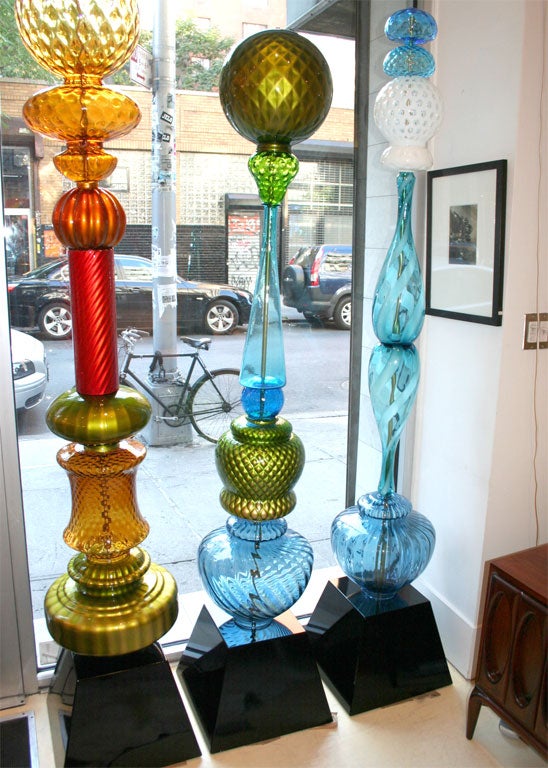 A tall sculpture made of decorative glass from the 1920's-1960's.<br />
This one is sold.