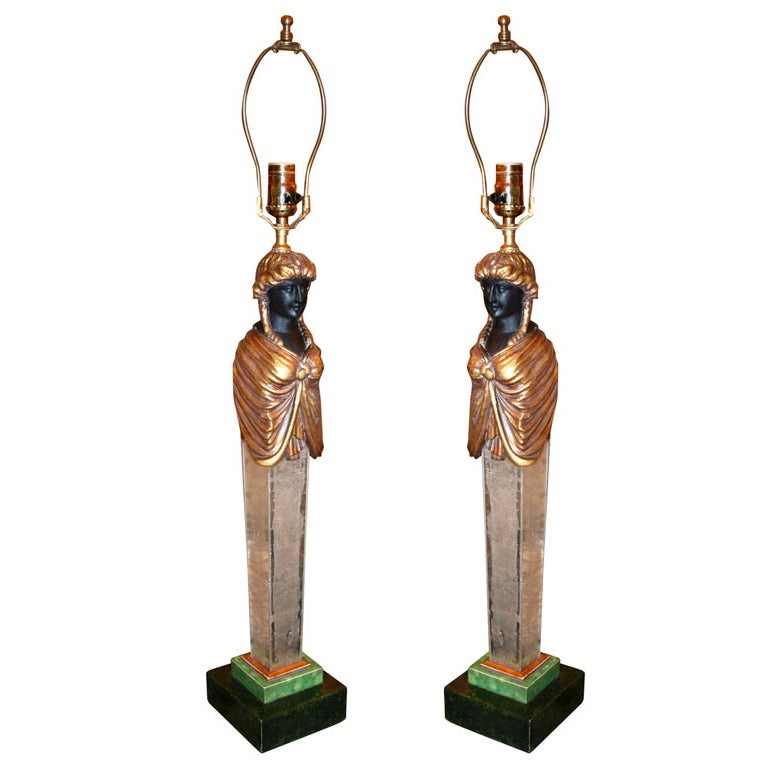 A pair of caryatid form talble lamps