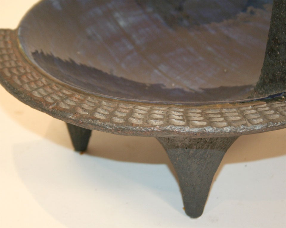 Original work by Dominique Pouchain of abstracted bird in the sculpted form of a bowl; unglazed and blue glazed ceramic; signed (a similar piece with green glaze is also available).