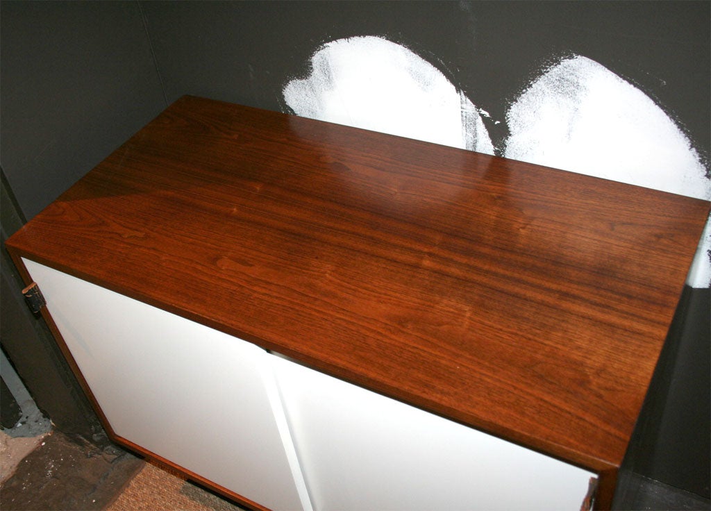 Knoll walnut credenza with white lacquered sliding doors-1950's In Excellent Condition In New York, NY