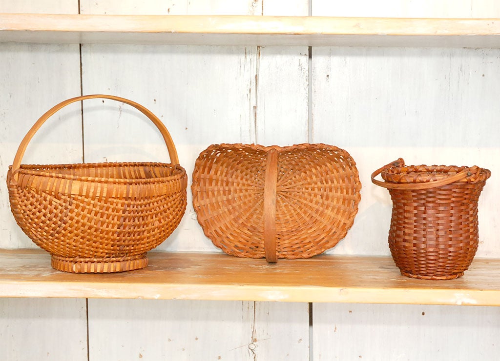 WONDERFUL GROUP OF THREE BASKETS FROM A COLLECTION W/ HANDLES ALL IN PRISTINE CONDITION.ALL HANDMADE OF HICKORY AND SPLINT .THESE BASKETS ARE GREAT FORM AND MINT CONDITION.SOLD AS A GROUP FOR 1850.FOR THE THREE .