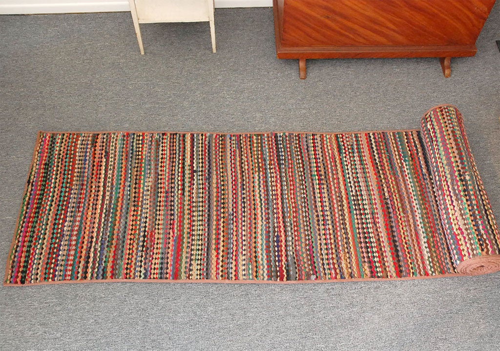 UNUSUAL RUNNER BRAIDED RUG  FROM PENNSYLVANIA .MULTI COLORS AND GREAT CONDITION.