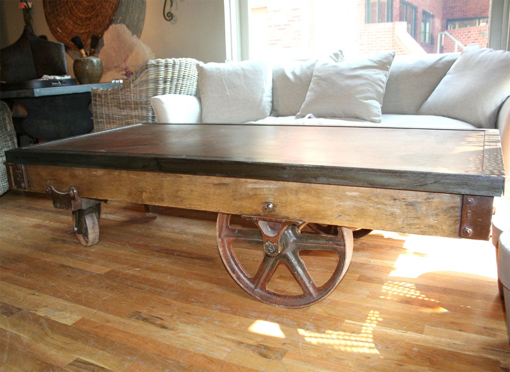 Coffee table made from industrial cart with metal top.