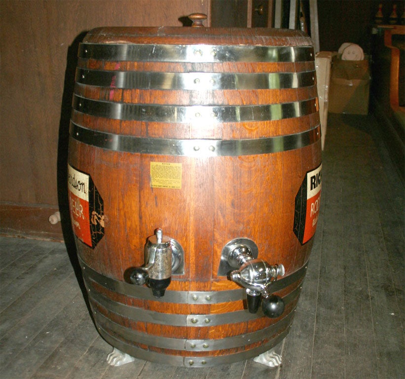 Authentic wooden Richardson root beer barrel dispenser with riveted steel bands and two spigots.