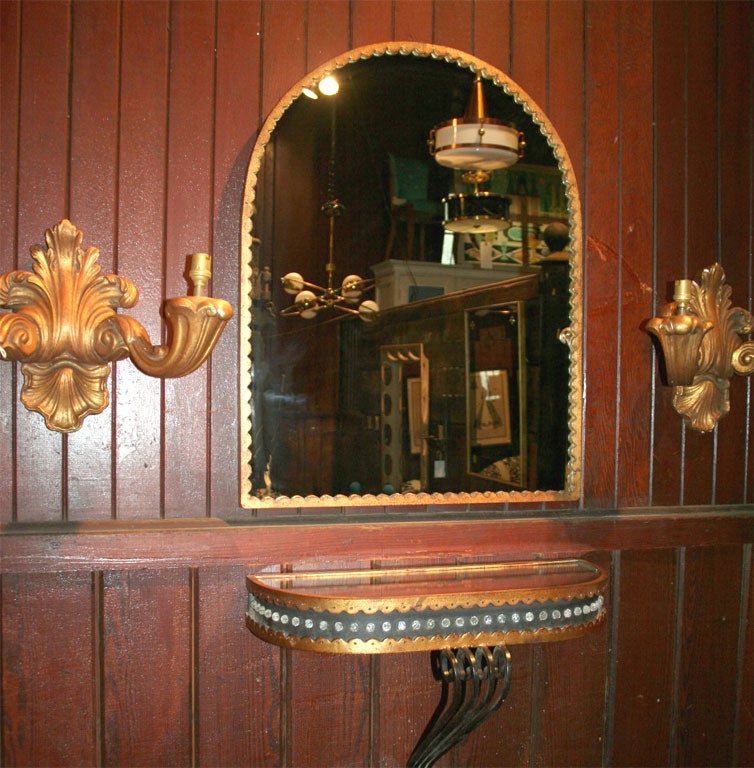 Arched top scalloped gilt metal mirror with matching mirror topped, crystal bead decorated wall console.