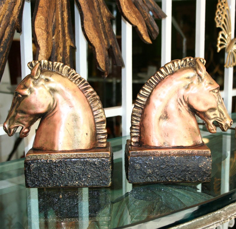Amazing horse head bookends or decorative statues. Greek key design at middle.