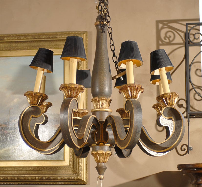 Hand carved wood and gilt eight arm chandelier.
