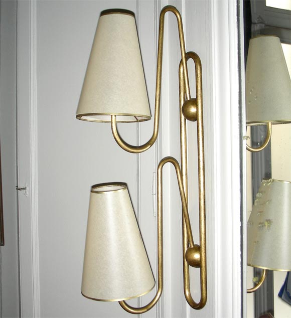 Two 1950s sconces by Jean Royère in gilt metal, with two branches.
Documented in book about the artist work.