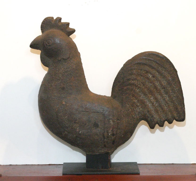 Elgin Co. Mogul rooster windmill weight. Intricately decorated three dimensional barnyard bird is the only hollow rooster form known.Tiny feathers stand out in stylized relief, and four pointed tail.