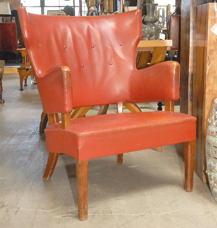 danish overstuffed easy chair in red leather