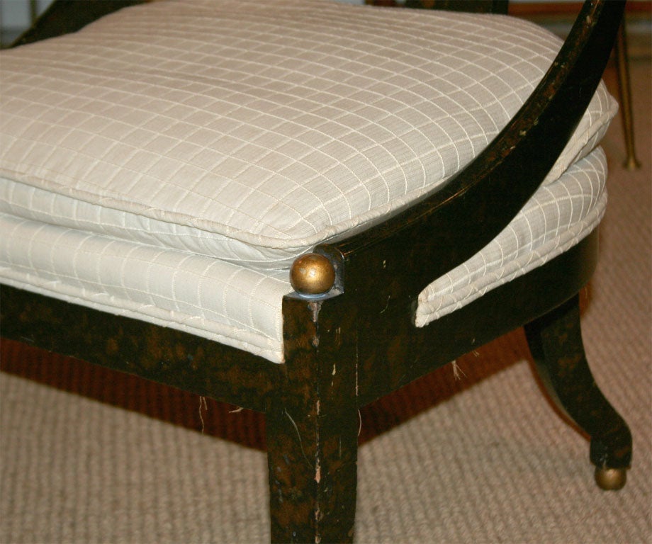 A fine example of a spoon back form chair with chic faux tortoise shell finish. Attributed to Michael Taylor for Baker. American, circa 1960.